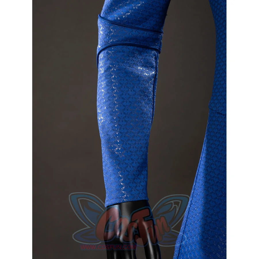 The Boys Homelander cosplay sleeve detail catches blue textured fabric beside the red cape edge.