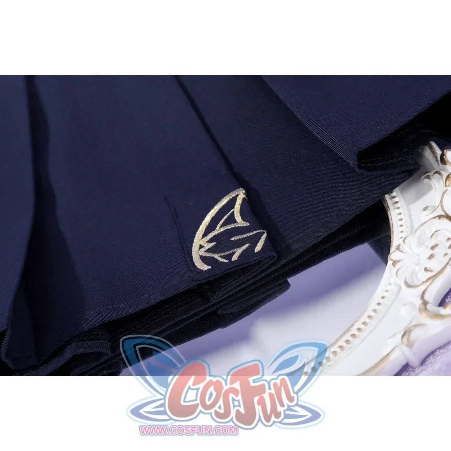 Honkai: Star Rail Evanescia cosplay skirt hem detail shows a small silver-tone emblem on dark fabric
