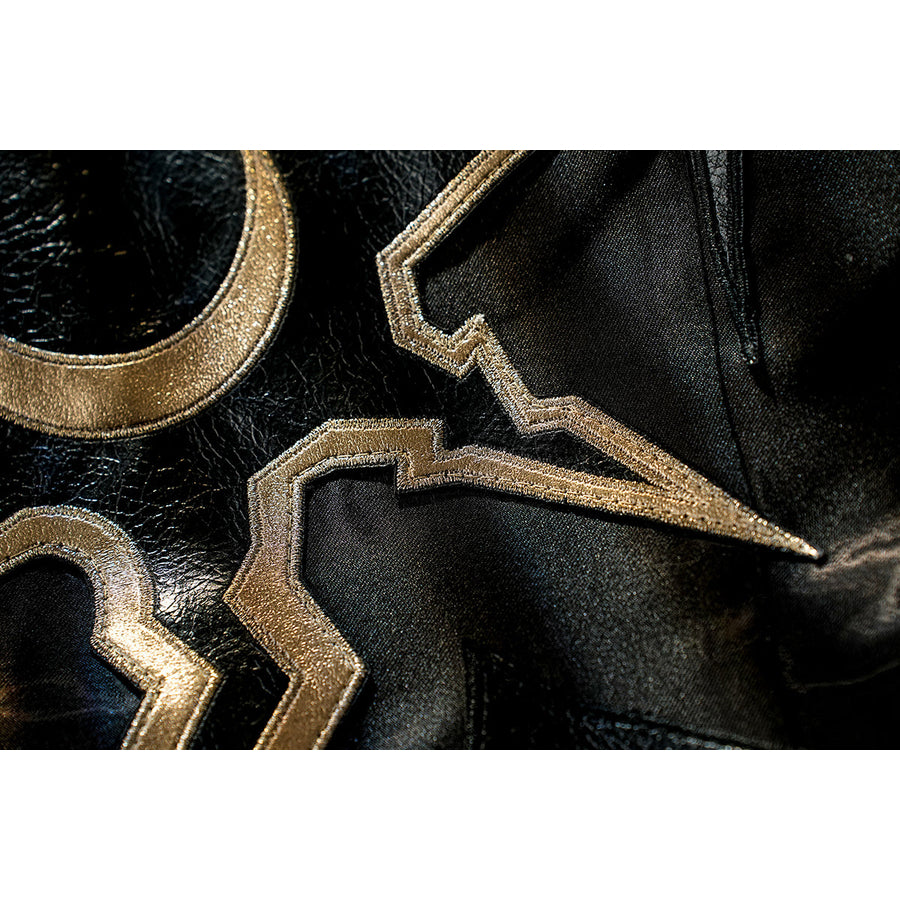 Honkai Star Rail Khaslana cosplay gold emblem close-up shows angular trim on glossy black fabric
