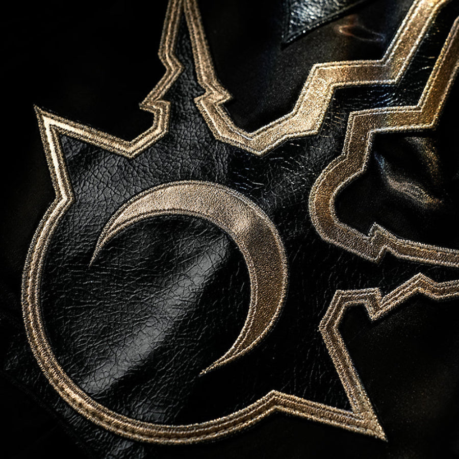 Honkai Star Rail Khaslana cosplay chest emblem detail shows gold linework over the black costume