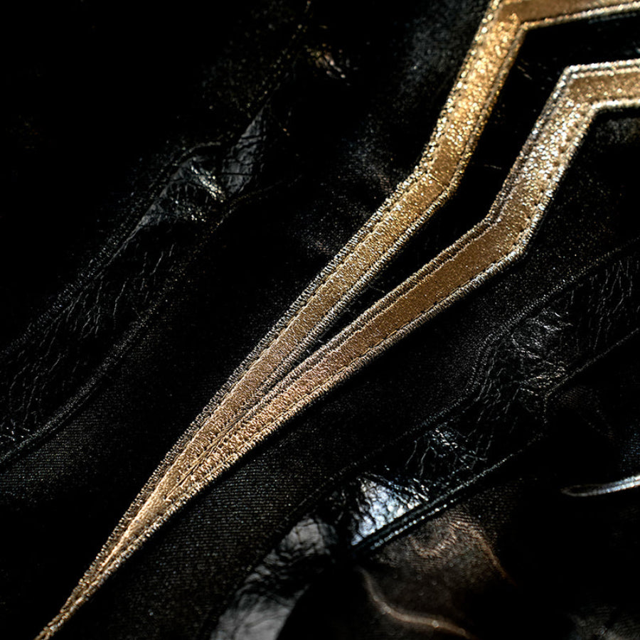 Honkai Star Rail Khaslana cosplay coat detail highlights raised gold trim over glossy black fabric