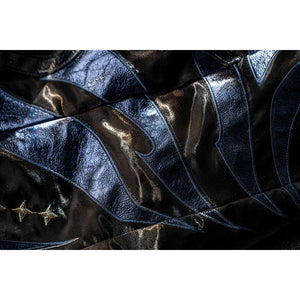 Honkai Star Rail Khaslana cosplay coat panel detail shows blue-black fabric edged by gold trim