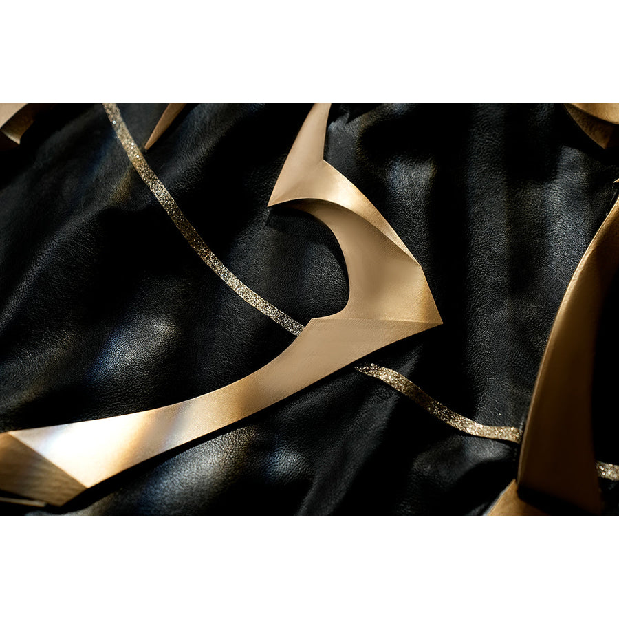 Honkai Star Rail Khaslana cosplay armor trim detail shows a crescent gold accent on black fabric