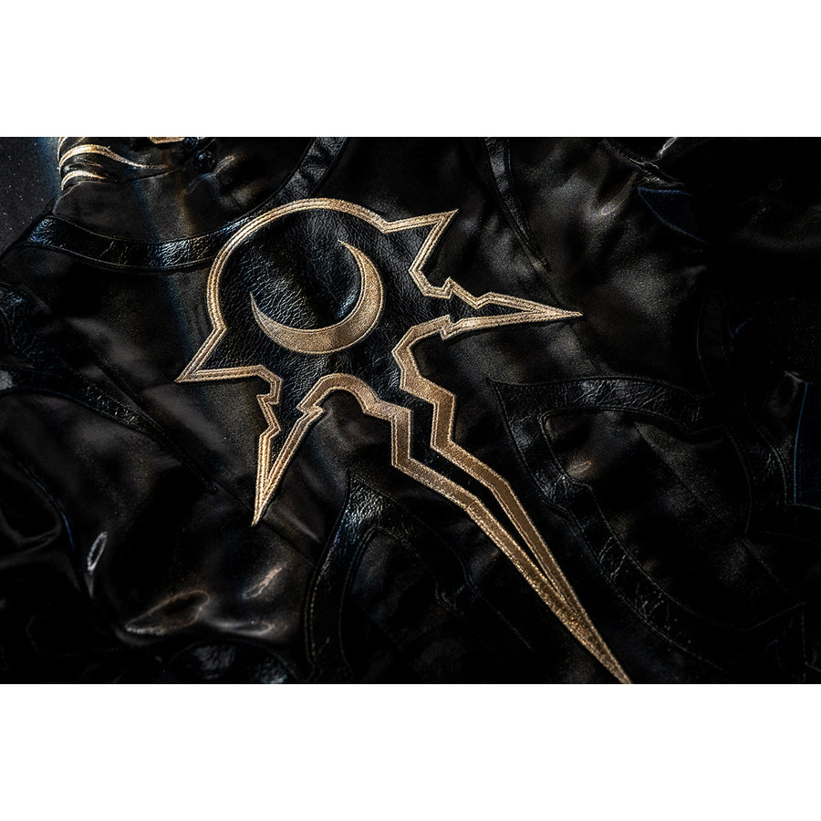 Honkai Star Rail Khaslana cosplay gold emblem detail shows sharp linework over glossy black fabric