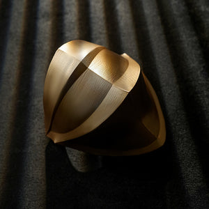 Honkai Star Rail Khaslana cosplay gold gauntlet detail shows a rounded armor plate