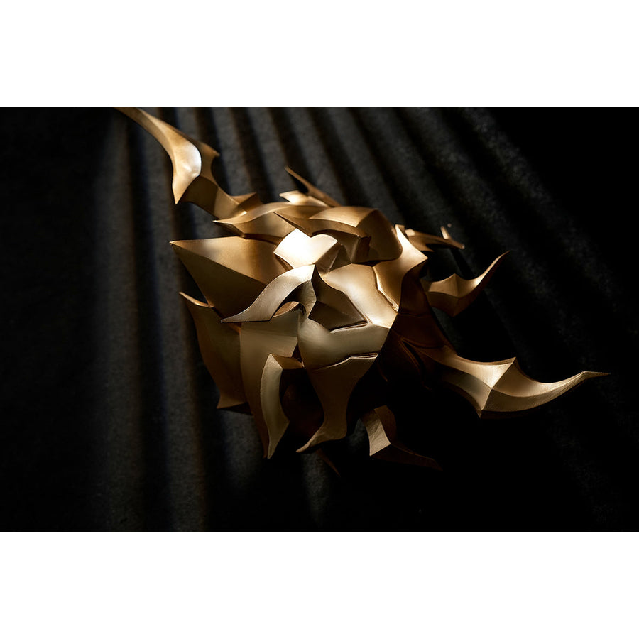 Honkai Star Rail Khaslana cosplay gold prop detail shows a spiked molded piece for the costume