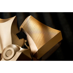 Honkai Star Rail Khaslana cosplay leg armor close-up reveals a brushed gold-tone panel