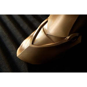 Honkai Star Rail Khaslana cosplay shoe armor side detail shows a curved gold cover