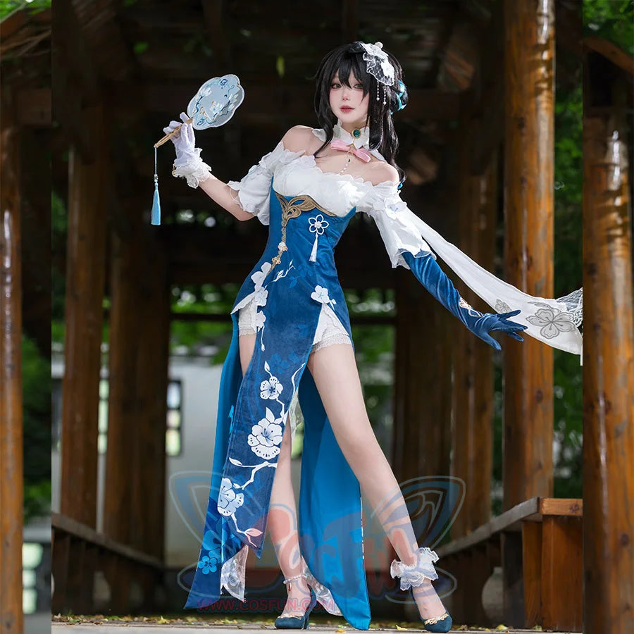 Honkai: Star Rail Ruan Mei cosplay costume frames a teal slit dress with white lace sleeves and a round fan.