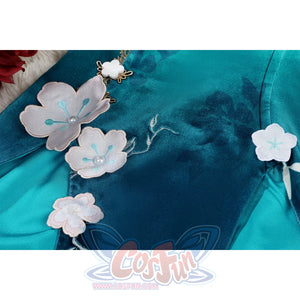 Honkai: Star Rail Ruan Mei cosplay costume flat-lay bodice detail sets gold trim and blossom charms over teal fabric.