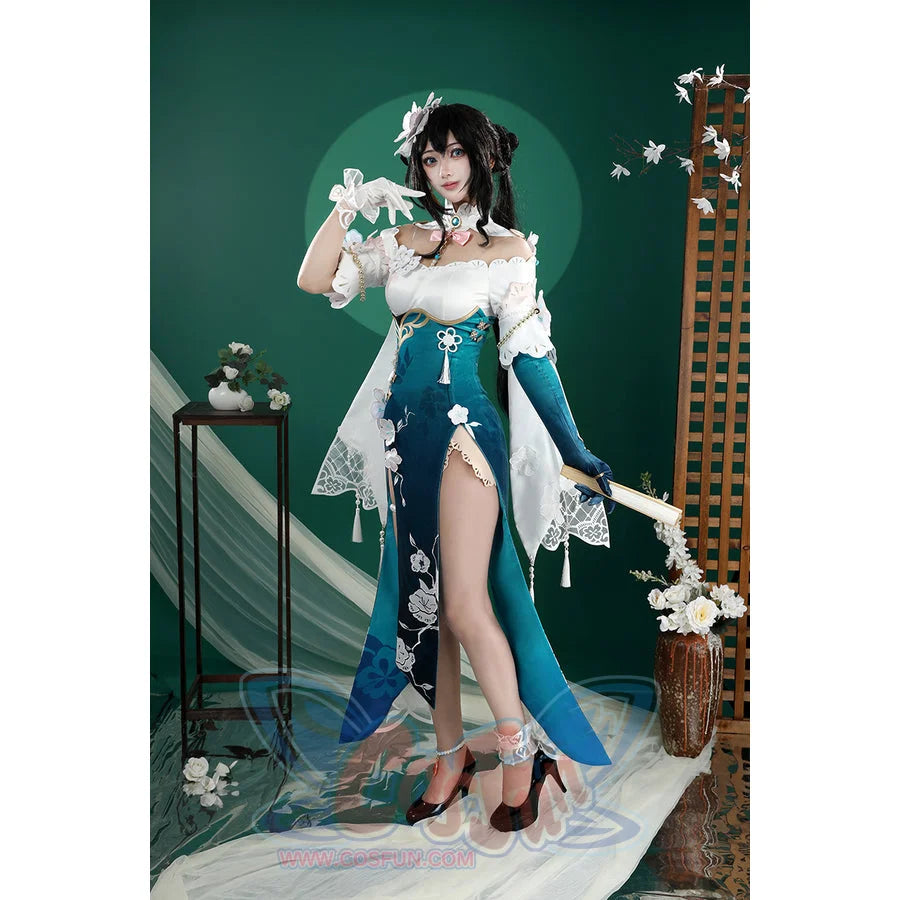 Honkai: Star Rail Ruan Mei cosplay costume sets a raised arm pose over a teal skirt panel and draped white shawl.