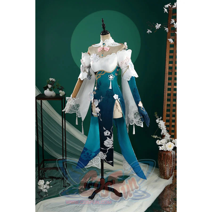 Honkai: Star Rail Ruan Mei cosplay costume balances the white shoulder shawl against split teal skirt panels.