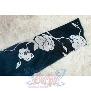 Honkai: Star Rail Ruan Mei cosplay costume flat-lay hem detail pairs dark teal fabric with white lace edging.