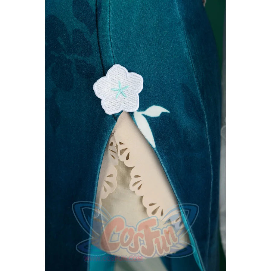 Honkai: Star Rail Ruan Mei cosplay costume side slit detail sets a white blossom accent beside the teal skirt opening.