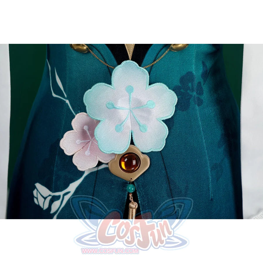 Honkai: Star Rail Ruan Mei cosplay costume skirt flower detail anchors a red gem drop under soft white petals.