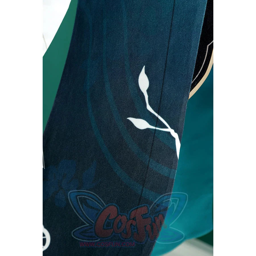 Honkai: Star Rail Ruan Mei cosplay costume teal fabric detail highlights a pale branch motif across the skirt panel.