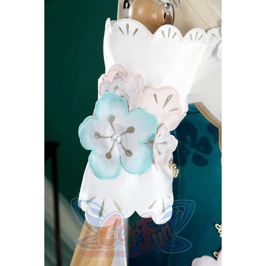 Honkai: Star Rail Ruan Mei cosplay costume wrist flower cuff detail layers pale petals and gold beads over teal fabric.