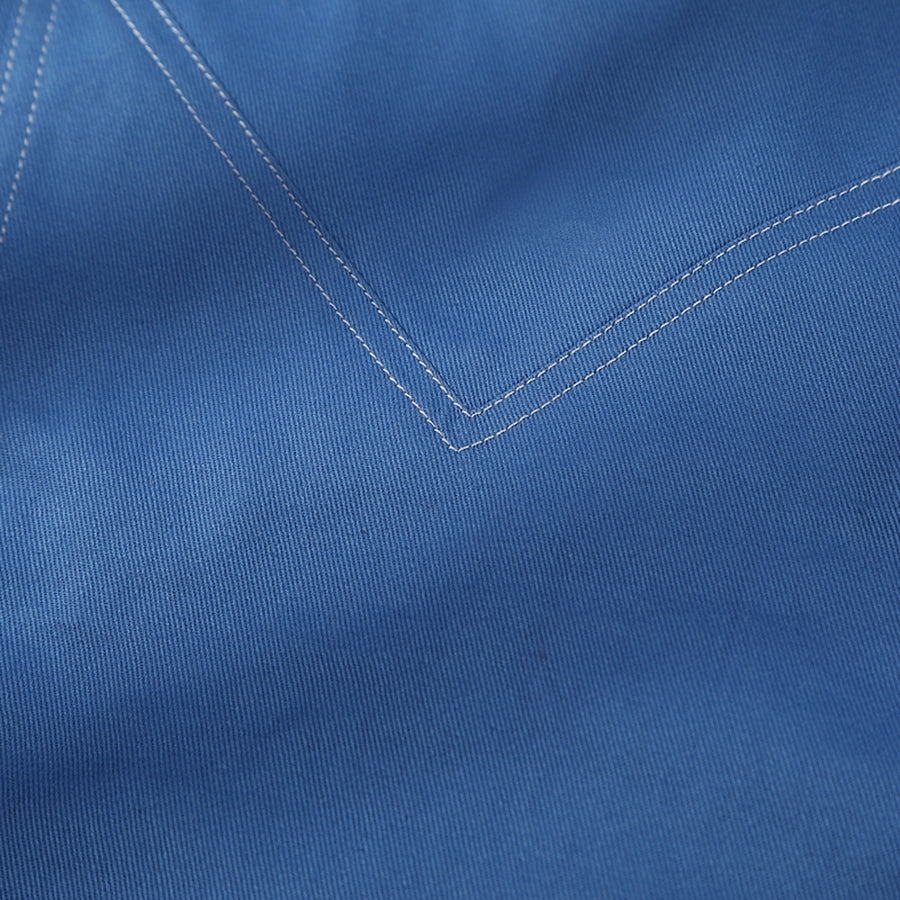 Human Torch Johnny Storm cosplay costume blue cotton twill fabric layers and frames the white double stitched V-shape seam.