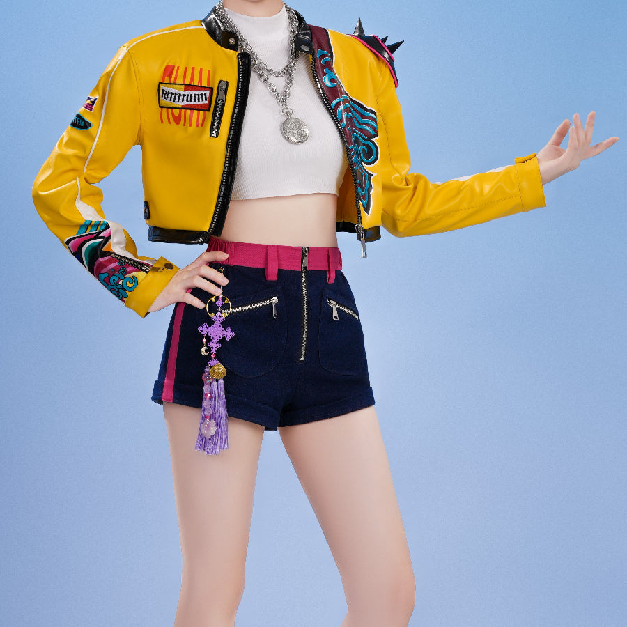 HUNTR/X Rumi cosplay costume upper front view layers a yellow cropped jacket over navy shorts and a purple charm