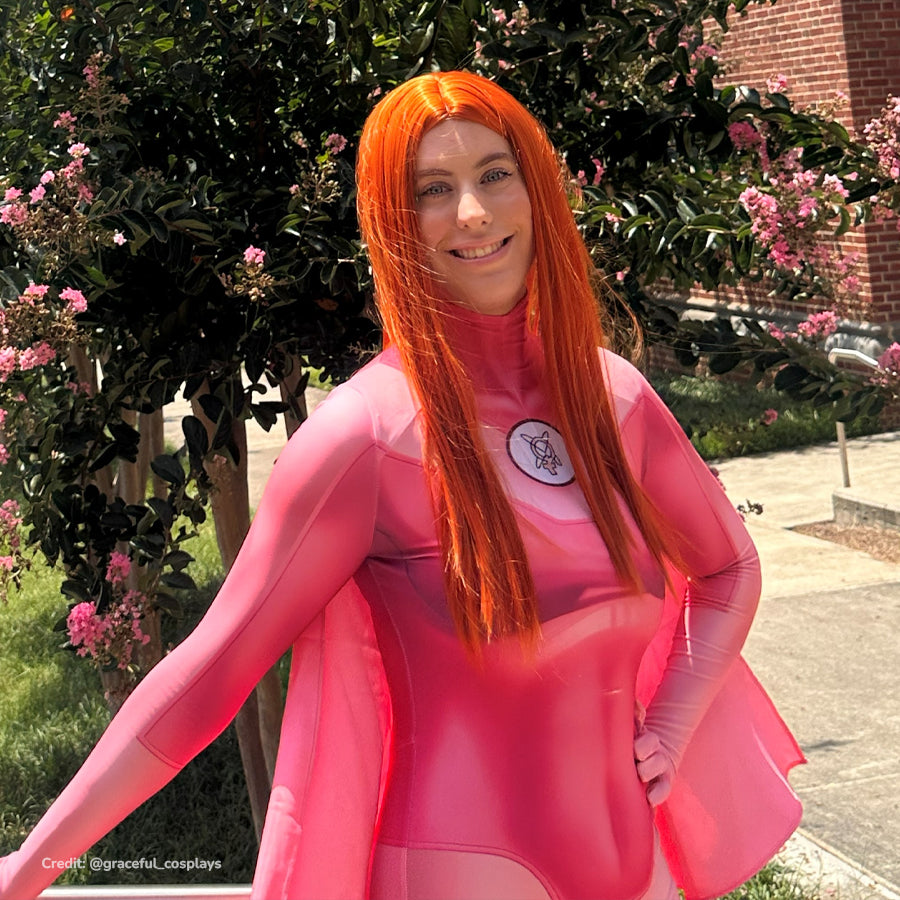 Invincible Atom Eve cosplay costume upper body view frames the chest emblem beside a sheer pink shawl.