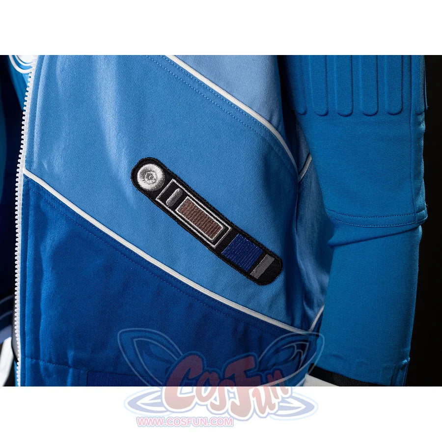 Invisible Woman cosplay costume jacket snap detail anchors a black tab against angled blue panels.