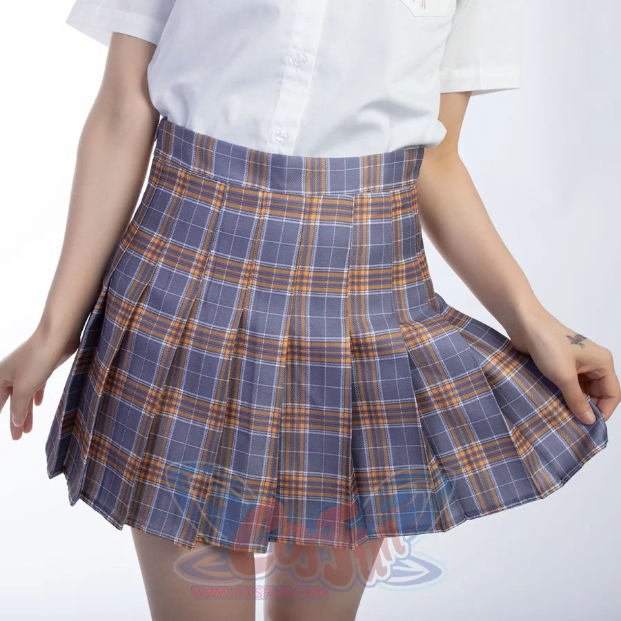 High-waist plaid pleated skirt front detail gathers wide folds across a gray base crossed by yellow lines.