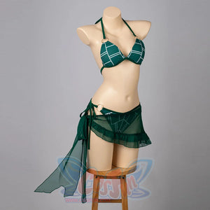 Jolyne Cujoh cosplay bikini front view pairs a green triangle top with side-tie bottoms and sheer skirt.