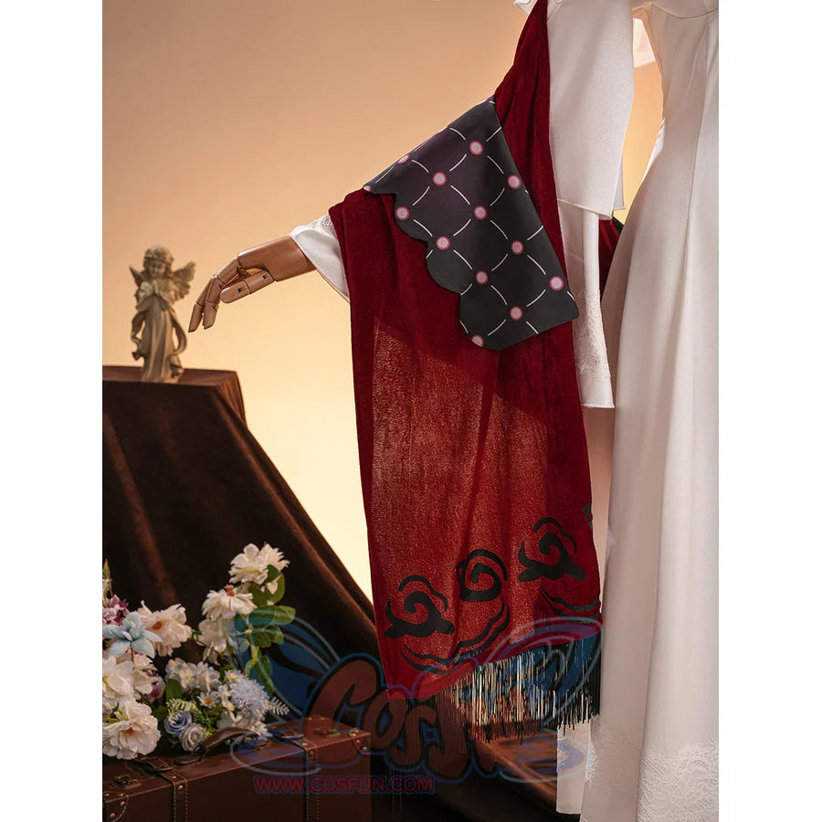 La Signora cosplay costume gathers red velvet fabric with a scalloped black patterned accent and long dark fringe trim.