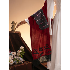 La Signora cosplay costume gathers red velvet fabric with a scalloped black patterned accent and long dark fringe trim.