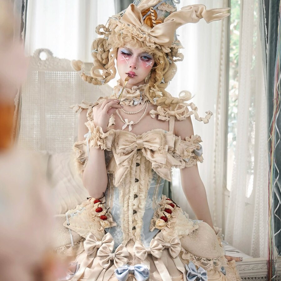 COSFUN front view of a cream Rococo corset top with detachable bow straps and cherry accents