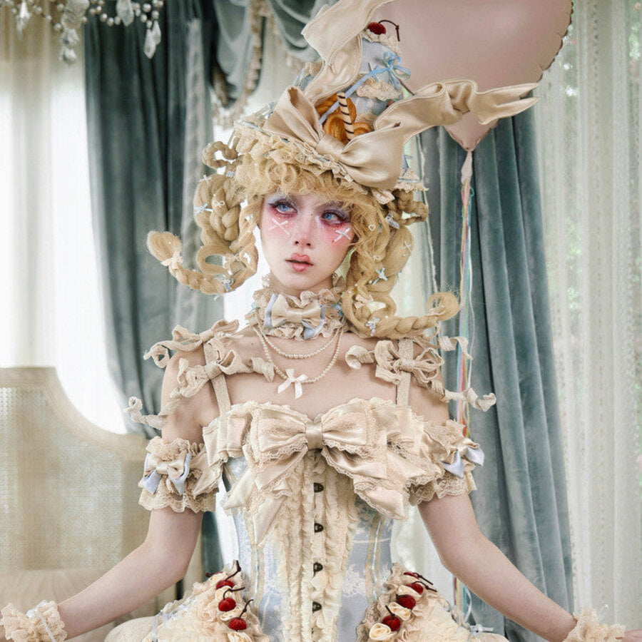 Portrait styling of the cream Rococo corset top with ruffled neckline and cherry details