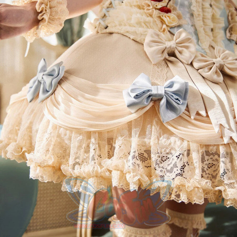 Close-up of the Lace Bow Skirt item with blue satin bows, gathered mesh, floral lace, and cream ruffles