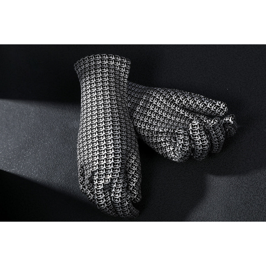 Latverian Witch cosplay costume frames metallic silver-tone patterned gloves with a detailed chainmail texture throughout.