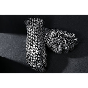 Latverian Witch cosplay costume frames metallic silver-tone patterned gloves with a detailed chainmail texture throughout.