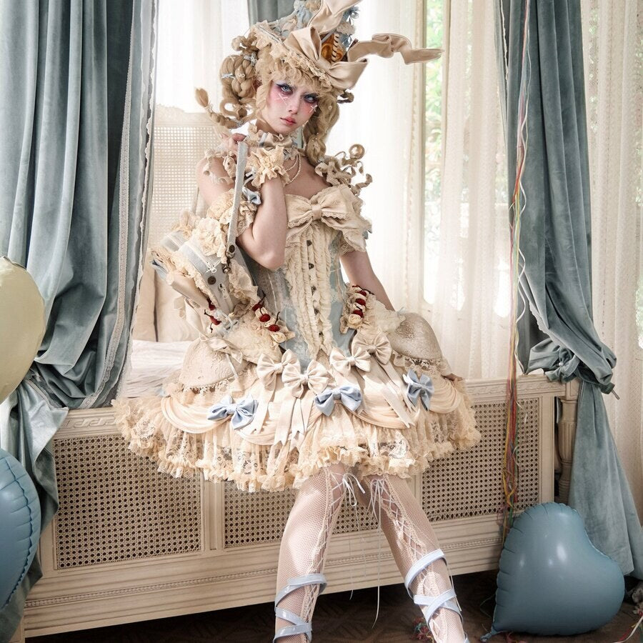 Full Lolita coordinate styling with a heart handbag and matching cream outfit
