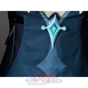 Lumine cosplay back ornament detail with a silver-tone turquoise piece centered on dark teal fabric.