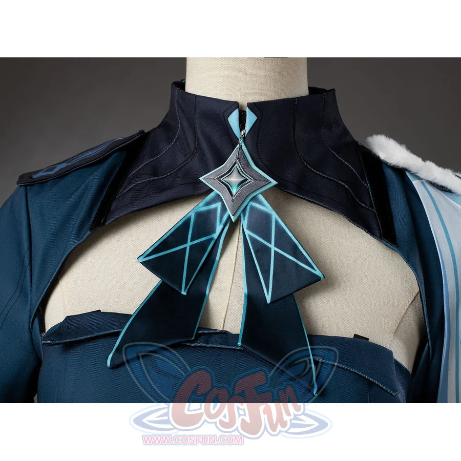 Lumine cosplay collar ornament close-up with turquoise lines and silver-tone edging over dark teal fabric.