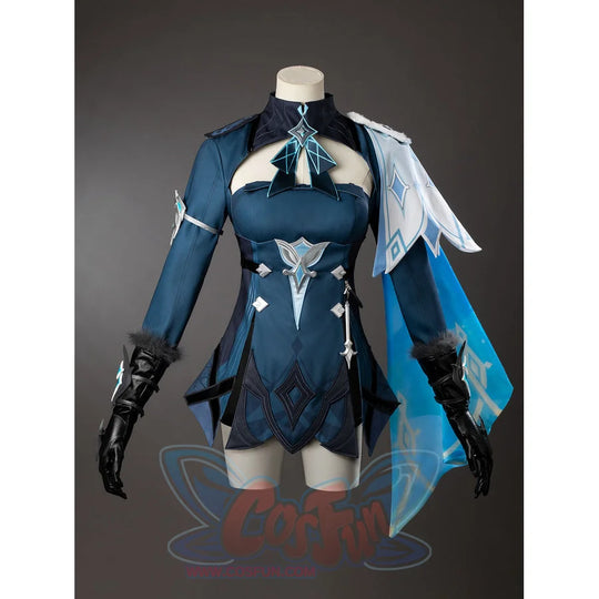 Lumine cosplay costume angled view shows pointed hem panels beneath a turquoise back drape beside black gloves.