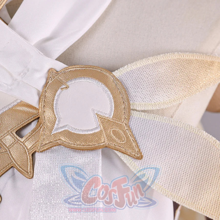 Close-up of Genshin Impact Lumine cosplay costume shoulder accessory with gold frame, white inset, and cream fabric