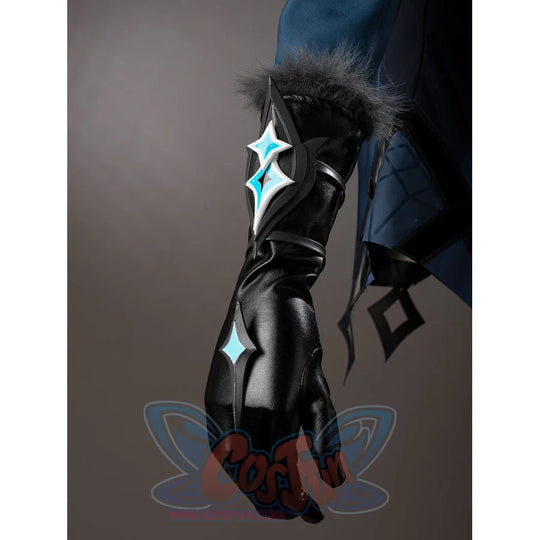 Lumine cosplay glove detail with a silver-tone turquoise ornament and gray fluffy cuff trim.