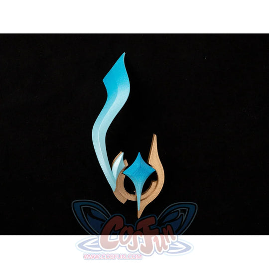 Lumine cosplay ornament flat lay with a turquoise ribbon and gold-tone curved piece arranged for viewing.