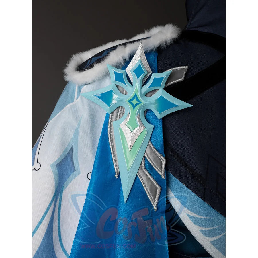 Lumine cosplay shoulder ornament close-up with turquoise and silver-tone points over the pale drape.