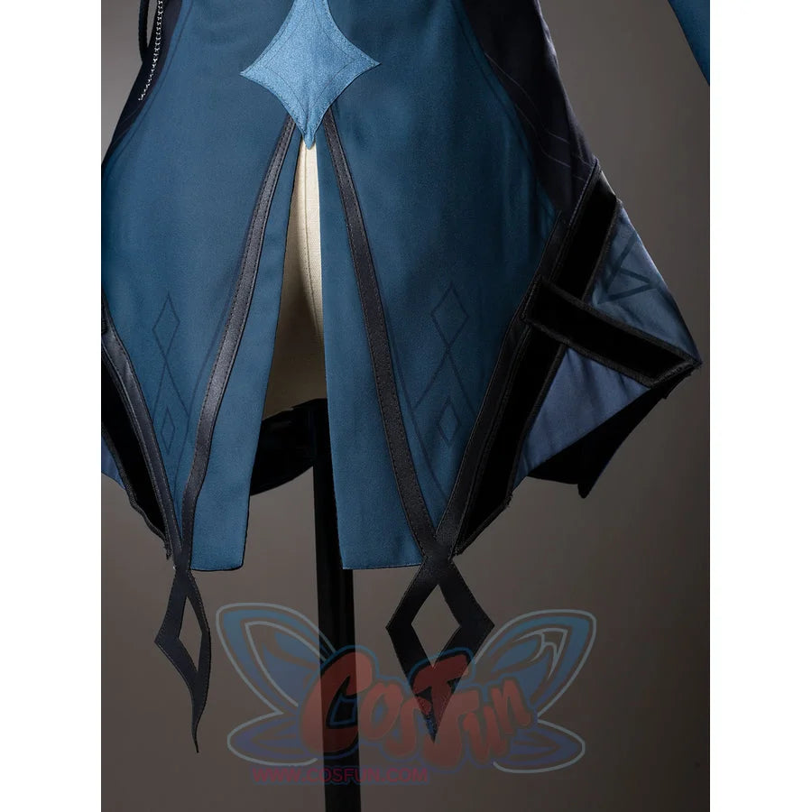 Lumine cosplay side hem detail with pointed dark teal panels and long narrow blue streamers.