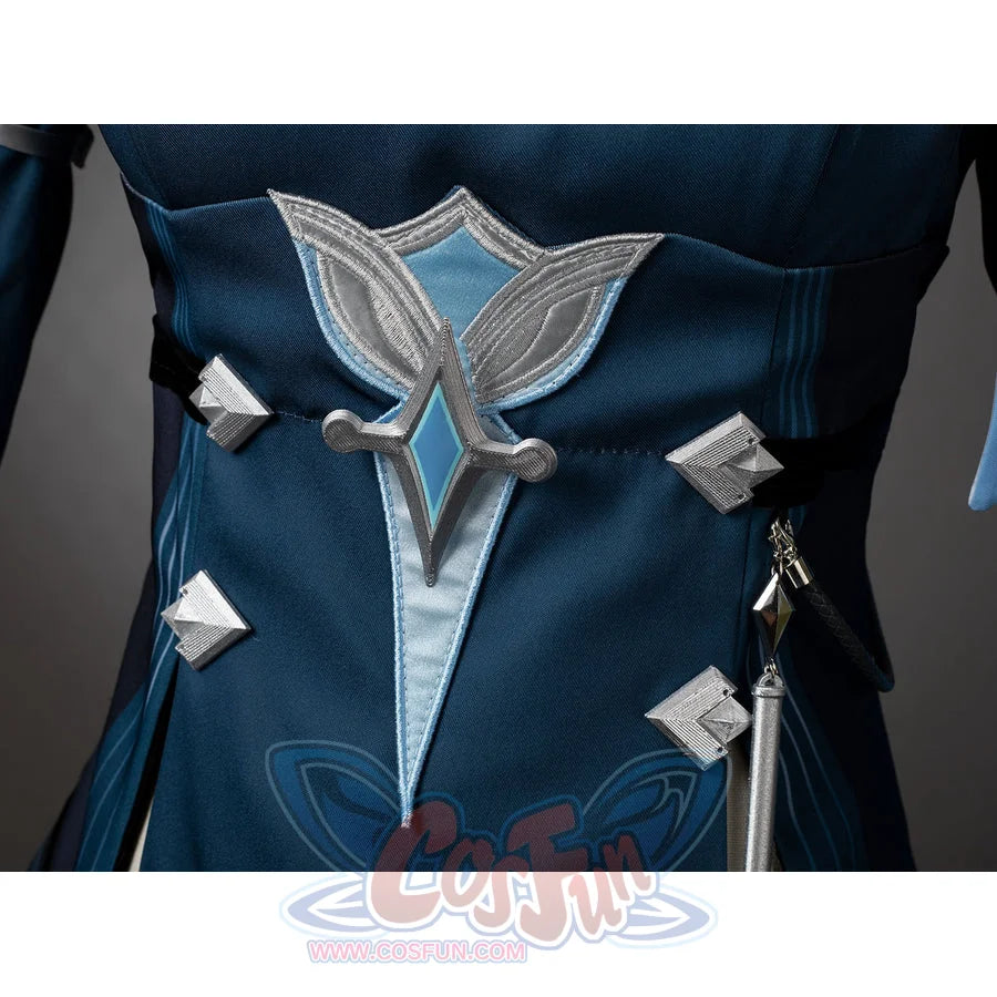 Lumine cosplay waist ornament close-up with a silver-tone leaf shape and turquoise center.