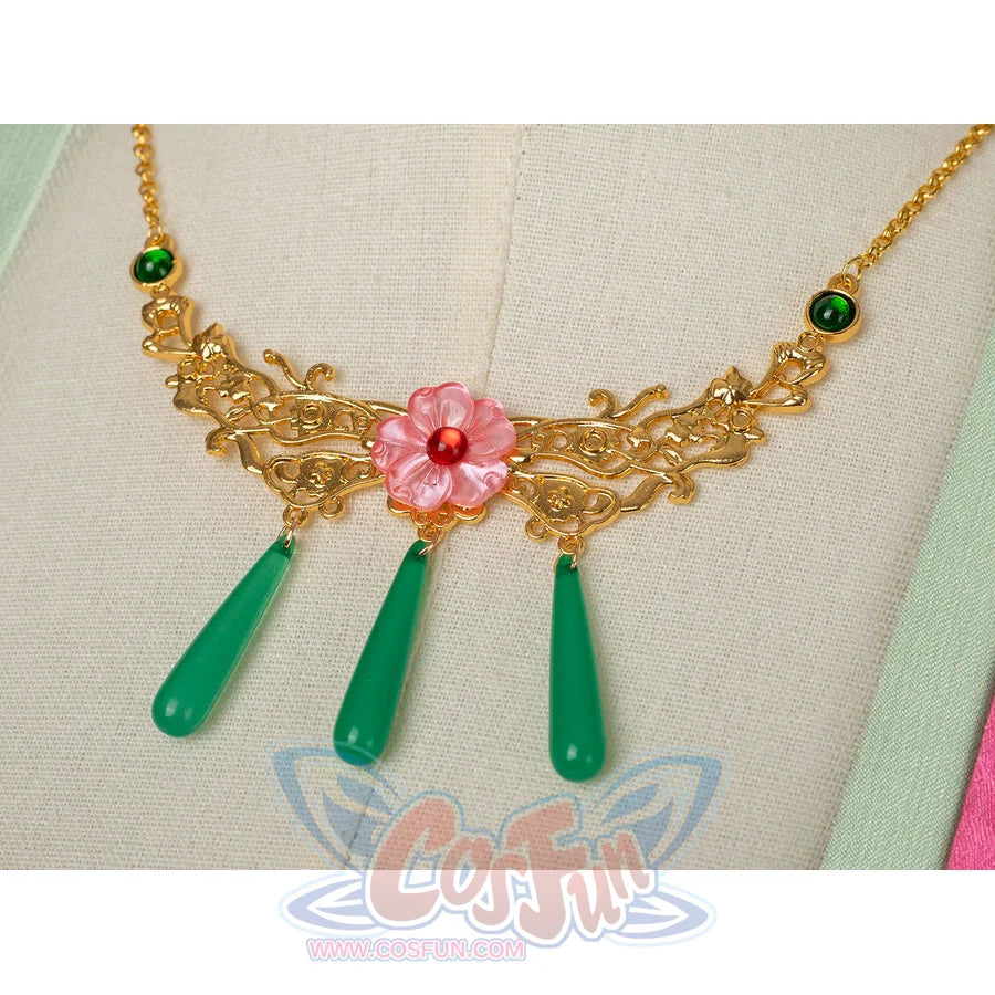 The Apothecary Diaries Maomao cosplay costume frames the gold-tone necklace around green drops and a pink flower.