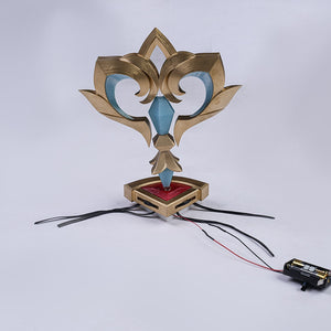 Genshin Impact Marionette Sandrone cosplay clockwork spring prop connects to an external battery case via black wires.