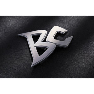 Marvel Rivals Black Cat Felicia Hardy cosplay BC logo detail rests in silver-tone metal on black fabric.