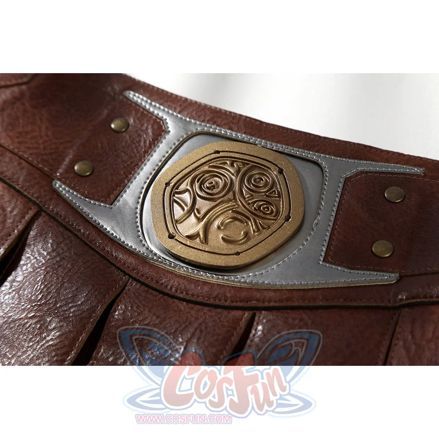 Masters of the Universe He-Man cosplay belt medallion close-up shows carved gold-tone detail set into gray trim
