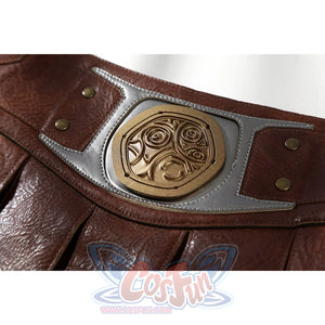 Masters of the Universe He-Man cosplay belt medallion close-up shows carved gold-tone detail set into gray trim