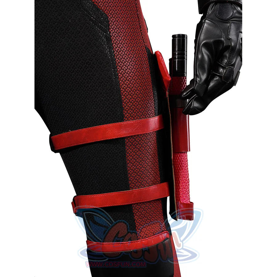Matt Murdock cosplay leg holster detail secures a red baton against textured black-and-red fabric.